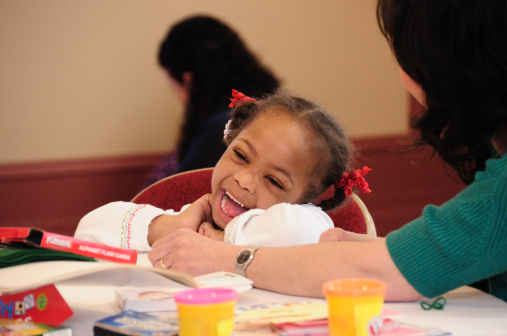 Child with Down syndrome laughing