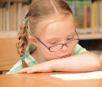 Child with Down syndrome thinking